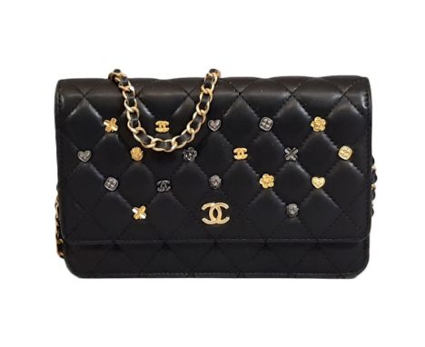 Quilted Charms Wallet by Chanel 2017 in black lambskin with chain and 16 charms on front flap. Interior has zipped compartmen