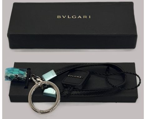 Bulgari Serpenti keyring with snakehead motif fob, leather band and silver hardware. In box, unused, protective seals in plac