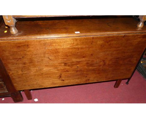 An early 19th century mahogany dropleaf dining table