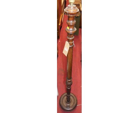 A turned and fluted mahogany standard lamp, h.169cm (excluding fittings)