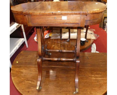 A Regency rosewood work table, having sliding top and twin hinged end compartments, w.73cm 