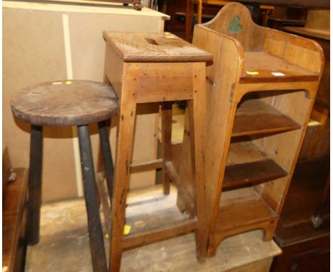 A rustic pine narrow low open shelf; together with a 19th century provincial joined elm workman's stool; and a circular workm