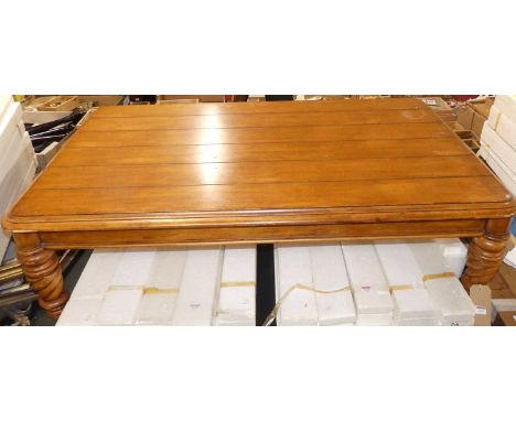 A hardwood plank topped round cornered coffee table, length 136cm 