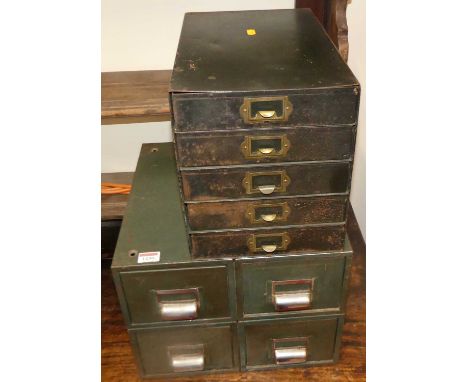 A steel table-top bank of four index filing drawers, w.36cm; together with a similar five drawer example, w.23cm (2)