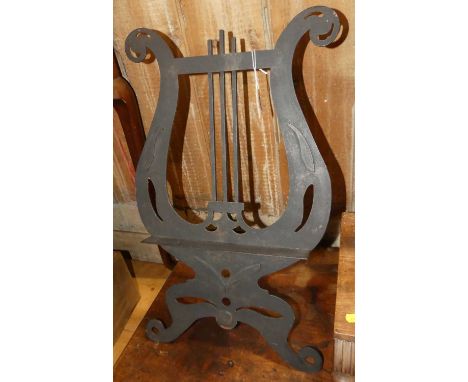 A black painted pierced steel table-top music stand 