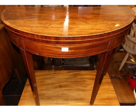 An early 19th century mahogany and rosewood crossbanded D-shaped baize lined fold-over card table, w.91cm 