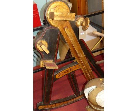 A decorative painted wooden gilt decorated novetly ships octant, titled Stewart &amp; Son, 109 x 95cm