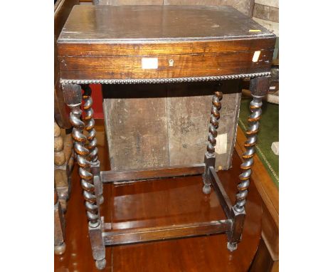 An early 20th century barleytwist oak hinge topped canteen table (lacking contents), w.46cm 