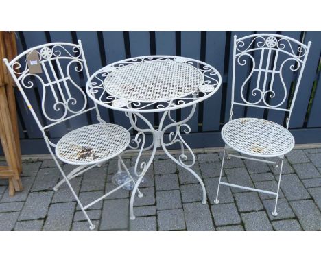 A contemporary white painted tubular and pierced metal circular garden table, with matching pair of folding chairs (3)