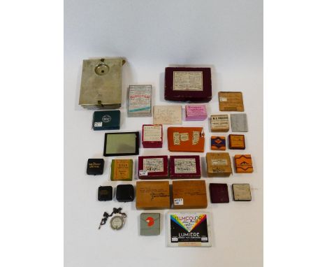 A collection of antique and vintage photographic lenses. Some in gilded fitted cases and other camera ephemera. H.5 L.20 W.16