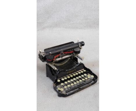 Corona black enamel metal typewriter inscribed L C Smith &amp; Corona Typewriters Inc, in carrying case. H.13 W.30cm 