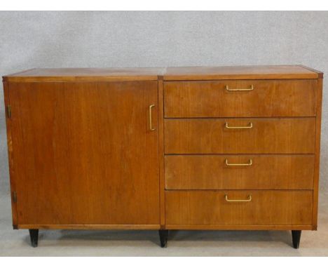 A 1960's vintage teak compact sideboard by Meredews Furniture. H.72 W.124 D.45cm 