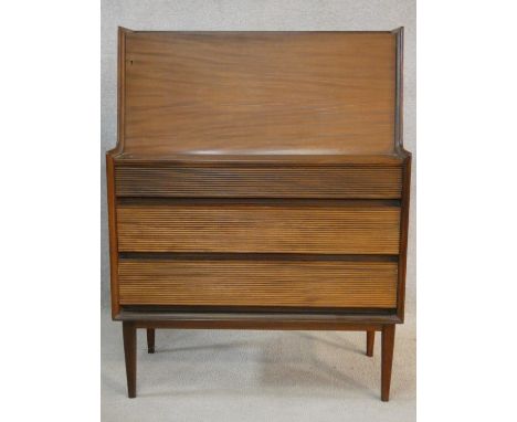 A Richard Hornby 1960's vintage afromosia bureau for Fyne Ladye Furniture with fall front enclosing fitted interior above ree