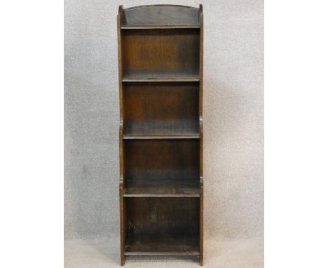 A narrow vintage oak waterfall open bookcase. H.115 W.37 D.23cm 