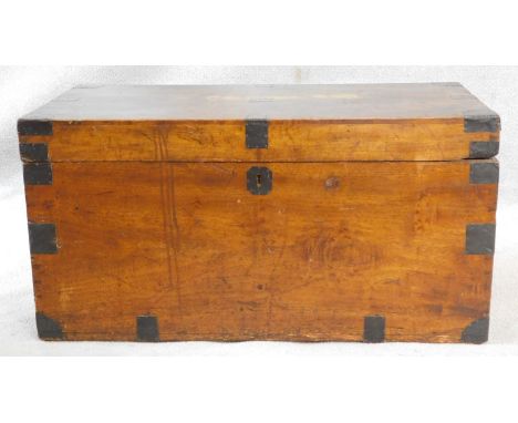 A 19th century metal bound camphor travelling trunk fitted with candle box and twin iron carrying handles. H.43 L.86 W.46cm 