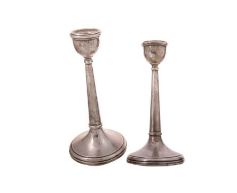 PAIR OF GEORGE V SILVER CANDLESTICKS NAPPER &amp; DAVENPORT, BIRMINGHAM 1922 each with urn sconce over a tapered column and c