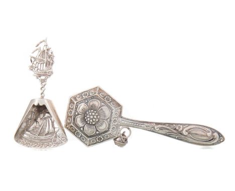 PORTUGUESE SILVER RATTLE AND A WHITE METAL CADDY SPOON EARLY 20TH CENTURY the rattle 835 standard, Porto, with floral detail,