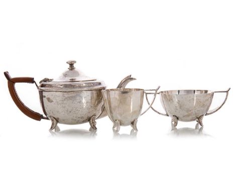 GEORGE V SILVER THREE PIECE TEA SERVICE HENRY WILKINSON LTD, SHEFFIELD 1917 comprising teapot, sugar and cream, the teapot wi