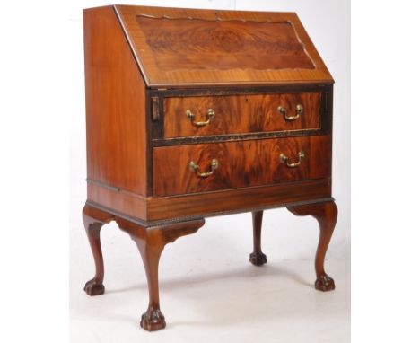 An early 20th century circa. 1940s Queen Anne Revival flame walnut bureau writing desk. The desk raised on cabriole legs, hav