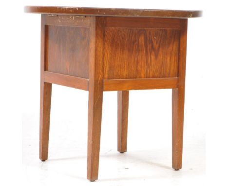 V Early 20th century oak sewing table / box. Circular tilt top on a square frame on tapering legs. Measures approx: 48x54cm
