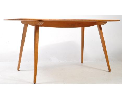 Ercol Windsor - Grand plank mid century circa 1960s beech / elm dining table. Standing on tapering angled legs, plank curved 