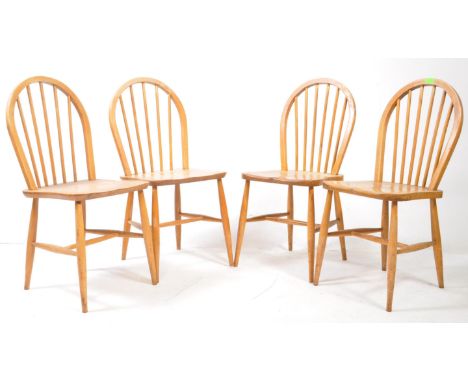 Lucian Ercolani for Ercol Furniture - Set of four mid century beech and elm hoop back Windsor pattern dining chairs raised on