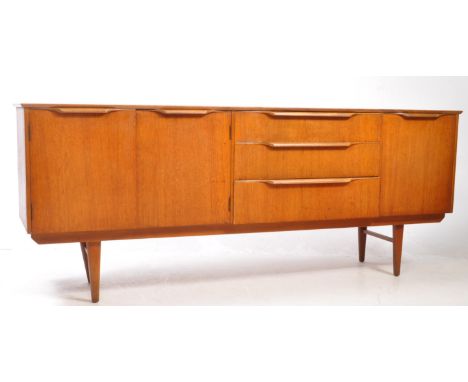 British Modern Design - Mid 20th century teak sideboard credenza. Rectangular form with twin pull down cupboards, bank of thr