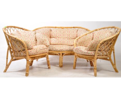 20th century bamboo and rattan weave conservatory suite. Comprised of two armchairs and a two seat sofa with round frames. Co