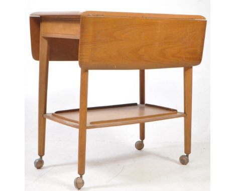 Ercol - a drop leaf tea table trolley on castors. Single drawer. Some wear to surface. Measures approx: 72x86x69cm