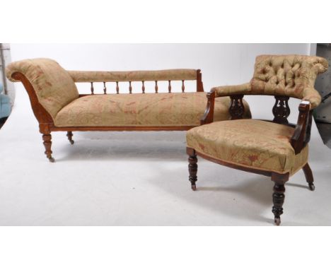 A late Victorian mahogany chaise longue day bed and tub armchair. The chaise raised on turned feet having scrolled backrest w