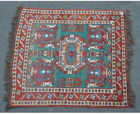 A mid century Persian Afghan Kilim hand knotted carpet floor rug. With central medallion, encapsulated in a border of repeati
