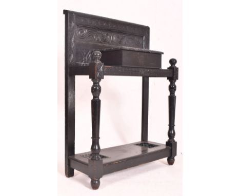 V A Victorian 19th century Jacobean Revival ebonised hall umbrella stand. The umbrella stand featuring panelled back with scr