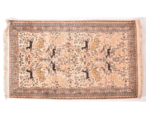 A 20th century Abu Dhabi Persian silk and wool machined floor carpet rug. The rug featuring central animal &amp; leopard Tree