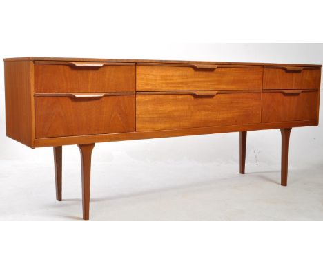Austinsuite - Mid 20th century teak sideboard credenza. Rectangular form with bank of two drawers to centre, flanked by anoth