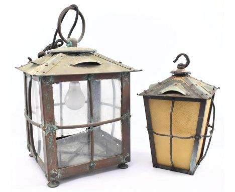 A Victorian Arts &amp; Crafts late 19th century copper &amp; glass porch lantern pendant light, together with another. The la