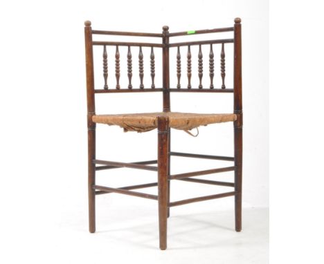 19th Century Victorian Arts &amp; Crafts movement bobbin turned corner chair of square form having bobbin turned column backr