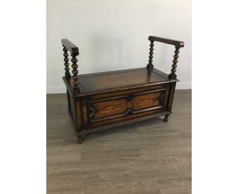 EARLY 20TH CENTURY OAK MONK'S BENCH,the arms on bobbin turned supports, 91cm wideCondition report: Both arms feel loose, part