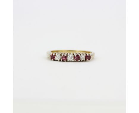 A hallmarked silver gilt ruby and white stone set ring, (K.5).