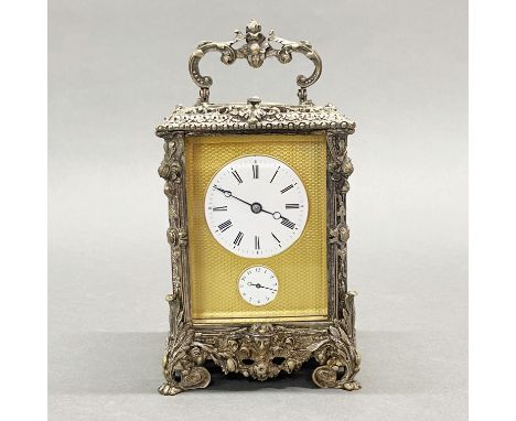 An impressive silver plated alarm carriage clock with repeat, H. 18.5cm.