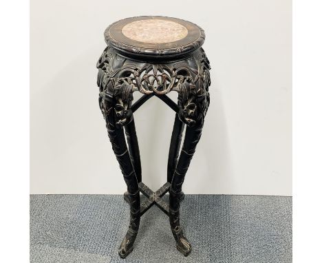 An early 20thC Chinese carved wood and marble plant stand, H. 92cm.