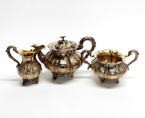 A heavy hallmarked silver three piece tea set, spout to handle 27cm, H. 18cm, gross weight approx. 1548gr.&nbsp;