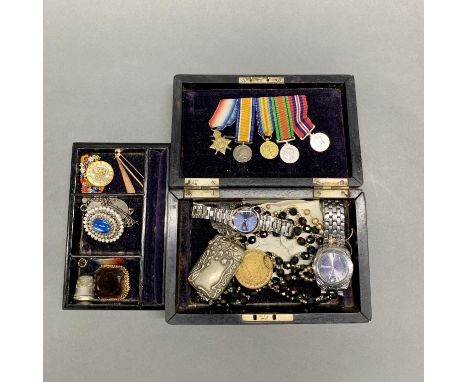 A silver mounted jewellery box and contents including miniature medals.