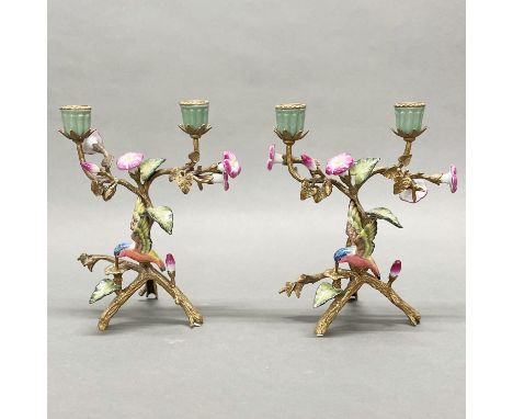 A pair of continental ormulu and porcelain candelabra, H. 25cm.