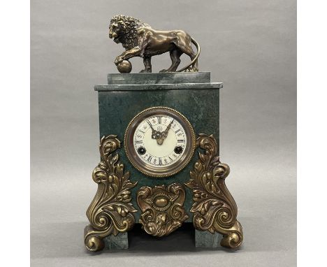 A reproduction bronze and marble mantle clock, H. 44cm.