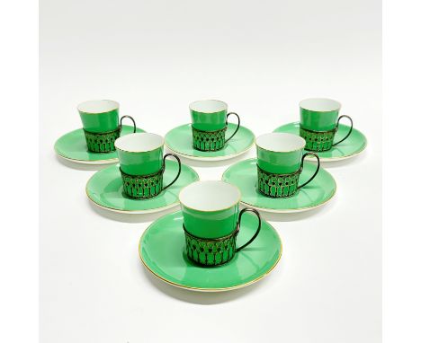A set of six Paragon porcelain coffee cups and saucers with hallmarked silver holders.