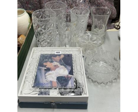 A large Waterford crystal photograph frame and other glass items.