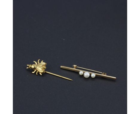 A yellow metal (tested minimum 9ct gold) and pearl bar brooch, L. 4.5cm, with a yellow metal bee stick pin.