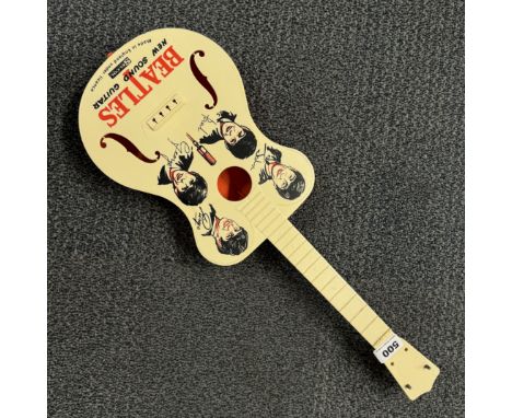 A Beatles Selcol plastic guitar, L. 59cm.