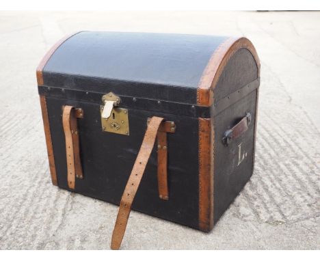 An early 20th century canvas and leather dome top trunk, 24" wide x 17" deep x 21" high 