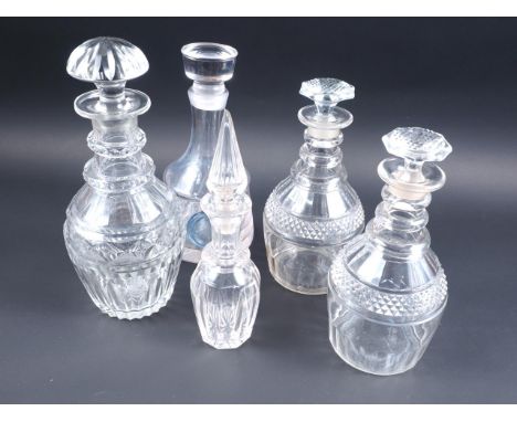 A pair of Georgian triple ring necked decanters and stoppers, and three other decantersCondition:The single decanter with blu